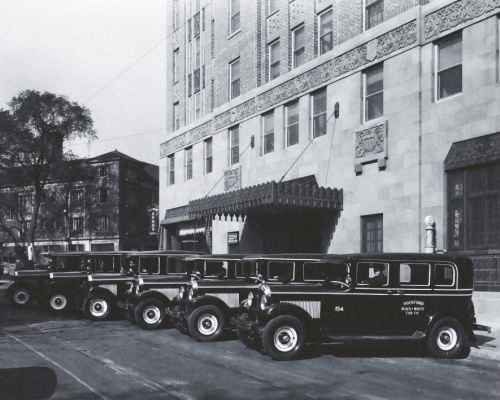 Taxi stand at the Faust Hotel, early 1930s.